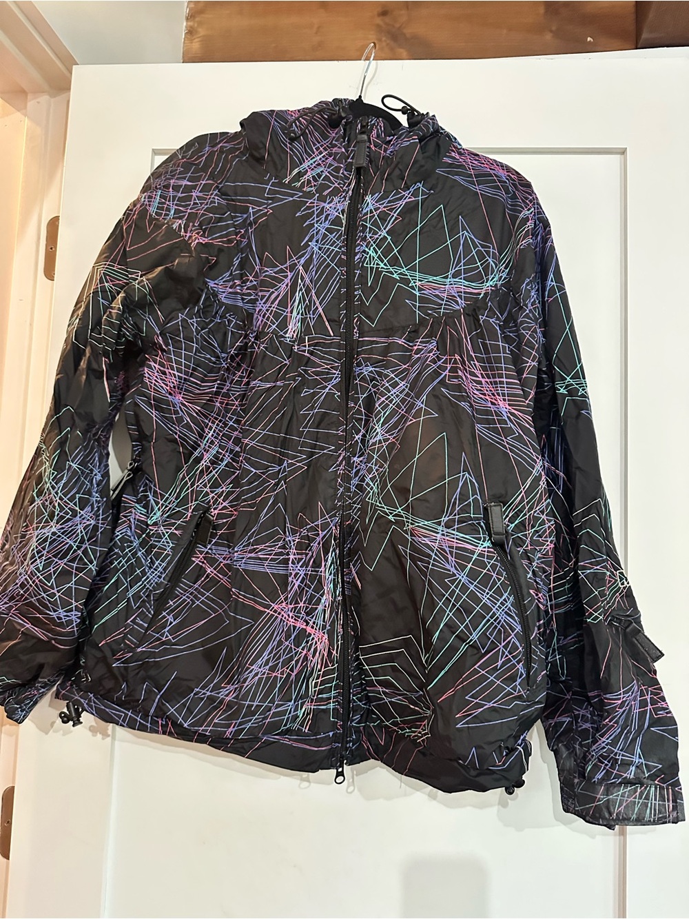 Women's Nikita Print Hooded Shell Jacket Rip on left shoulder